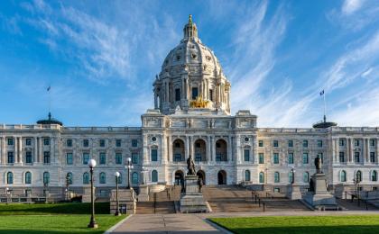 The Minnesota Capitol with white clouds and a blue sky